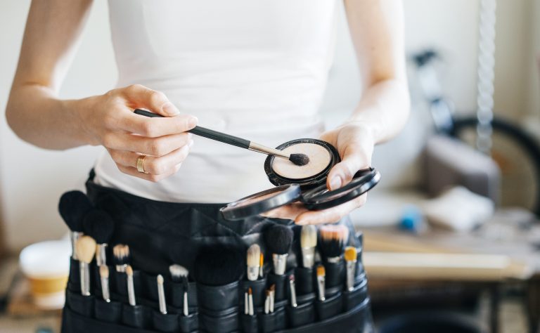 Professional,Make-up,Artist,With,A,Belt,Bag,With,Tassels.,Makeup